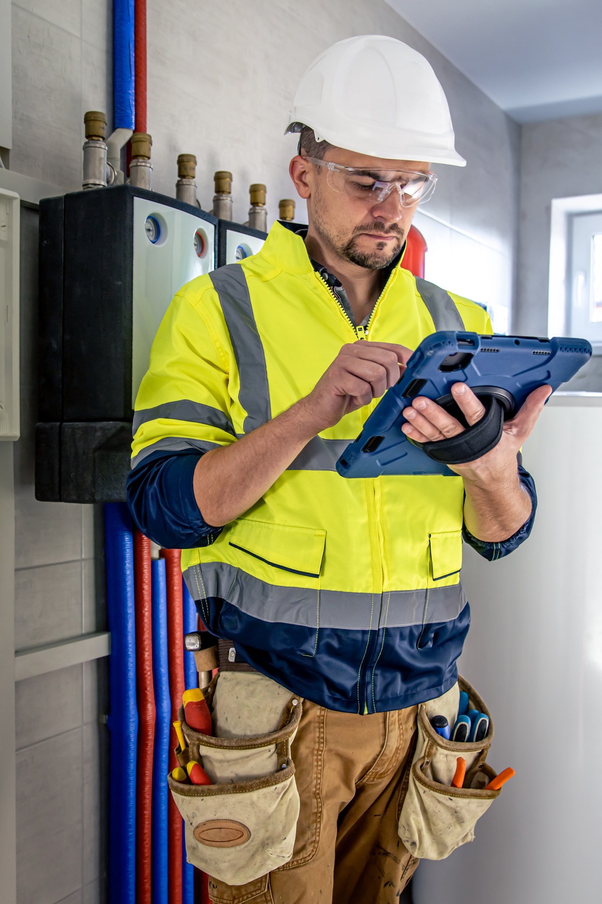 Field technician using a tablet during diagnostics.